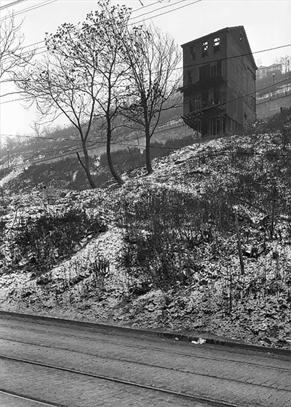 The last remaining of 7 homes that lined Mattisee Street. Credit: House Ready to Fall Down Hill, December 3, 1930, Pittsburgh City Photographer Collection, Historic Pittsburgh Site.