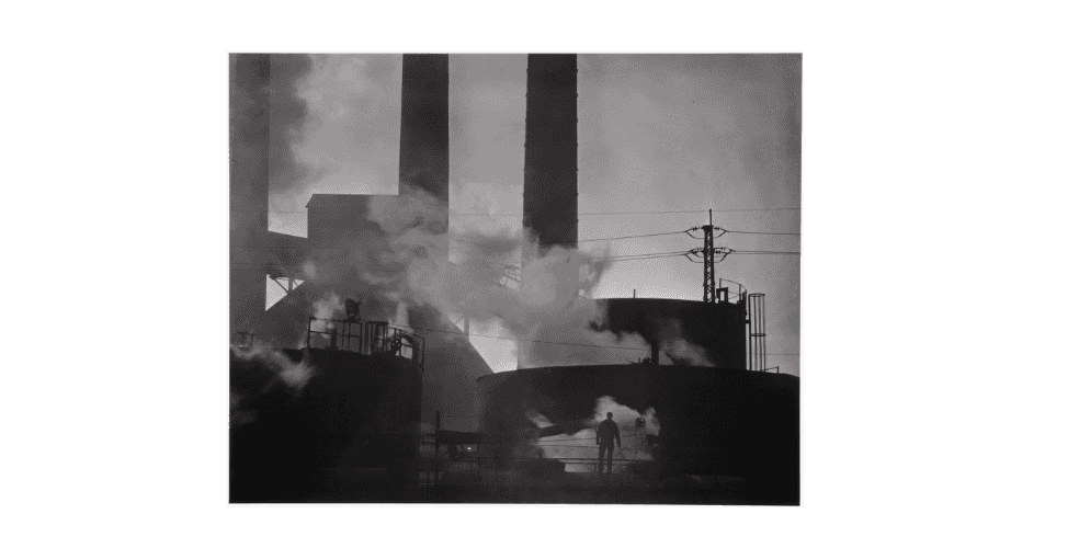 A lone steel worker among the smokestacks in the area. 