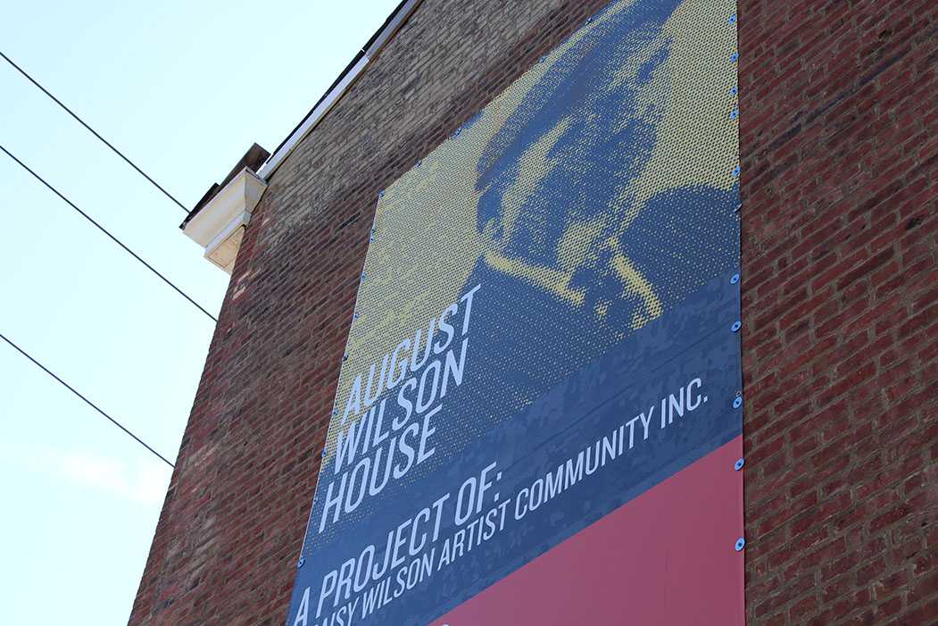 Wilson on a banner for the mission of the building. (Taken by Christopher Fisher)