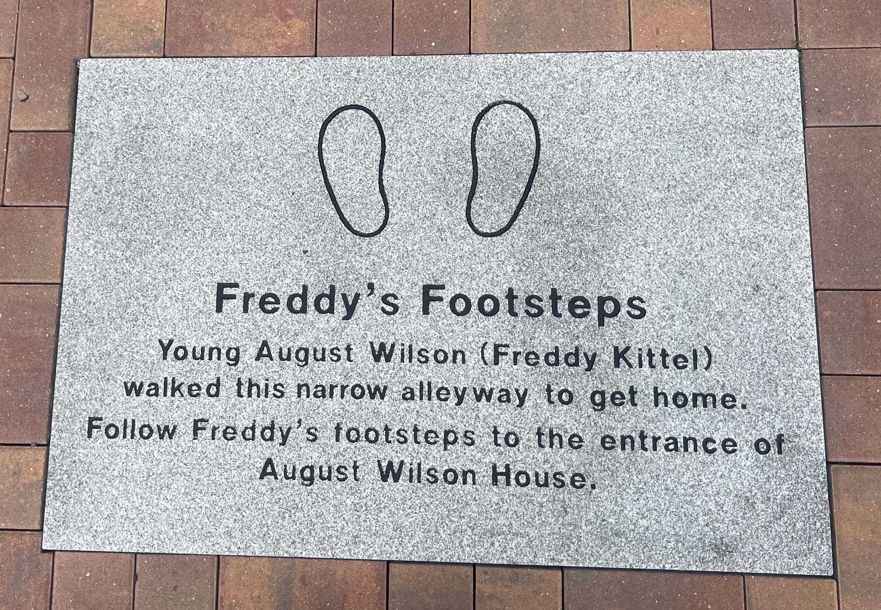 "Freddy's Footsteps" stone marker outside the August Wilson House. Photo by Kelsey Shuck, 2023.