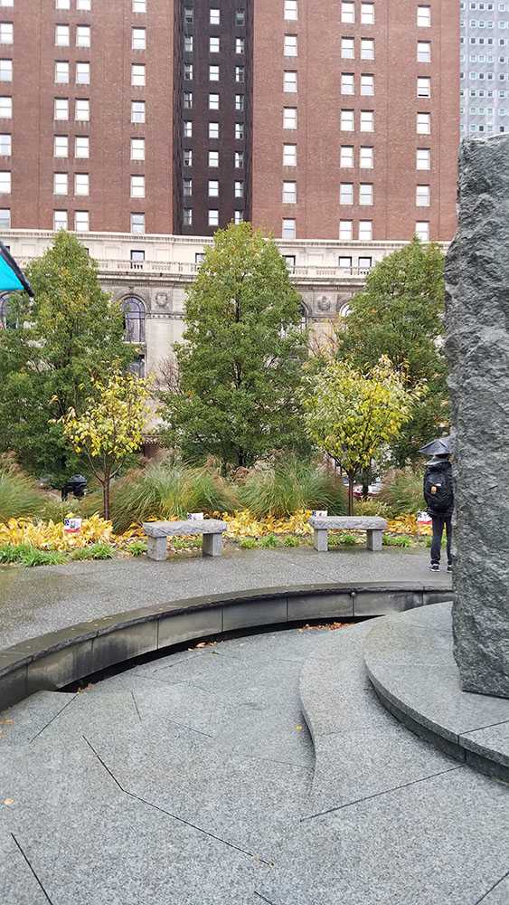 Greenery and benches creating an outer circle around the fountain. Photo by Elizabeth Madison. 