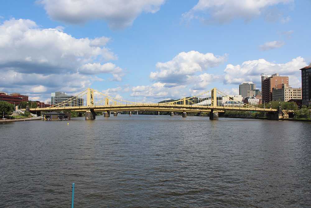 Photo by Frankie Bonamo, 2021. A wide angle of 2 of the Three Sisters yellow suspension bridges